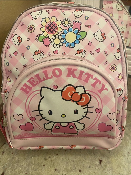 Hello Kitty Handbags - Hello Kitty mini Backpack with front zippered pouch. NWT